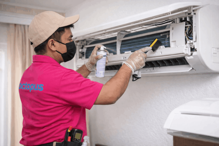 Ac Not Cooling In Dubai? 7 Causes + Quick Fixes (2026 Guide) Technician servicing air conditioning unit