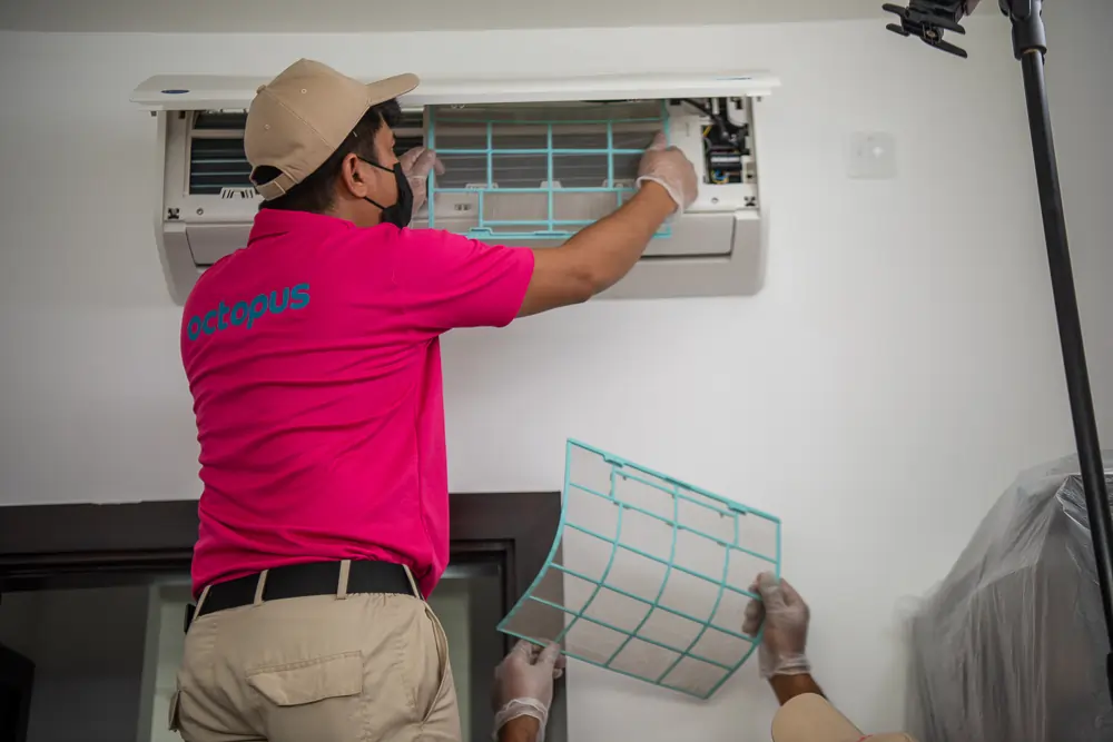 Ac Maintenance Services In Dubai Octopus technician installing air conditioning unit